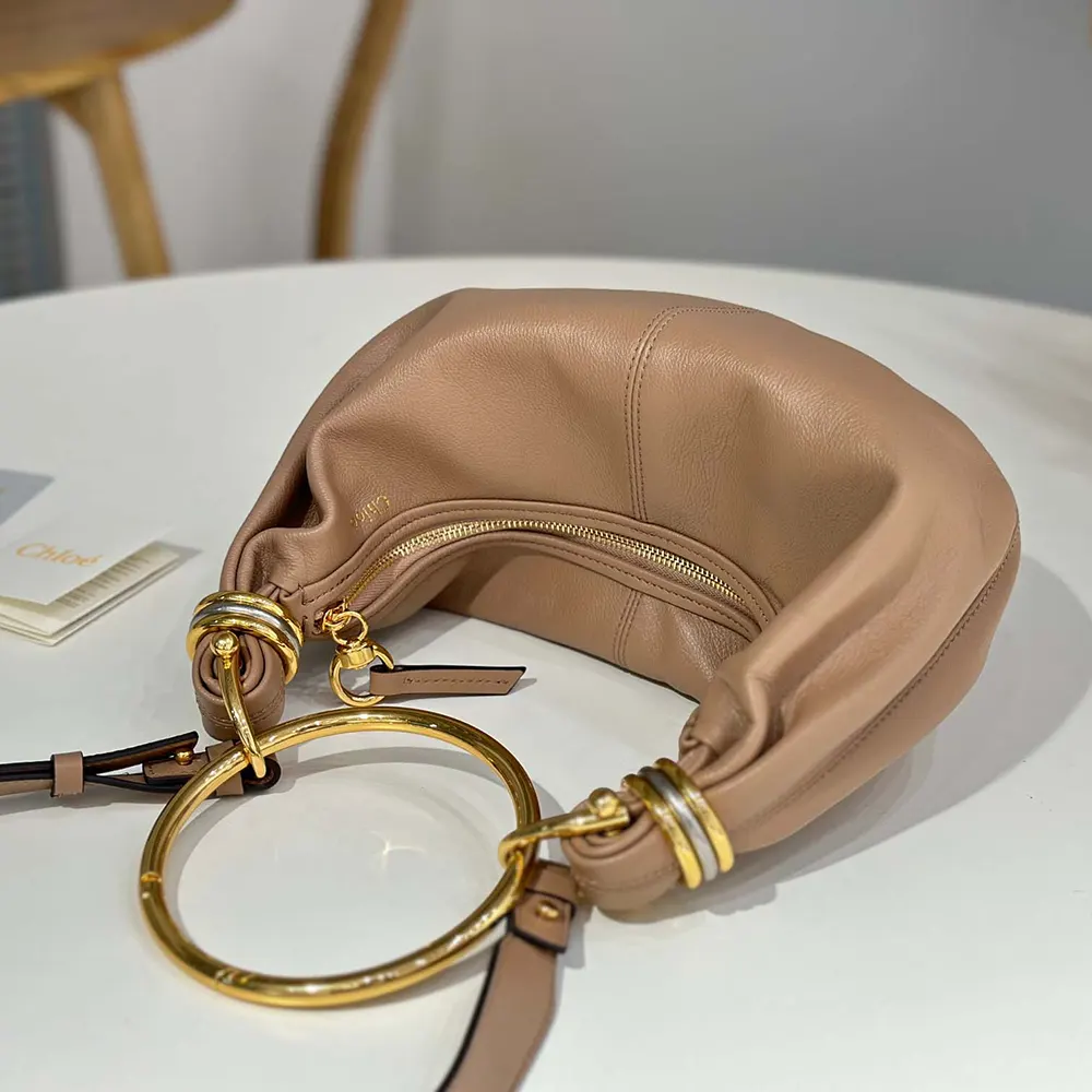 Side angle showing silhouette and texture of Chloe Women Small Bracelet Hobo Bag