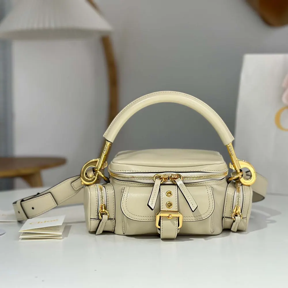 Close-up on gold-tone zipper and hardware of Chloe Women Small Camera Bag