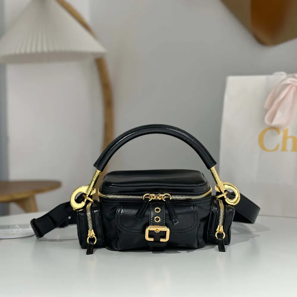 Close-up of gold hardware and shiny leather on Chloe Women Small Camera Bag