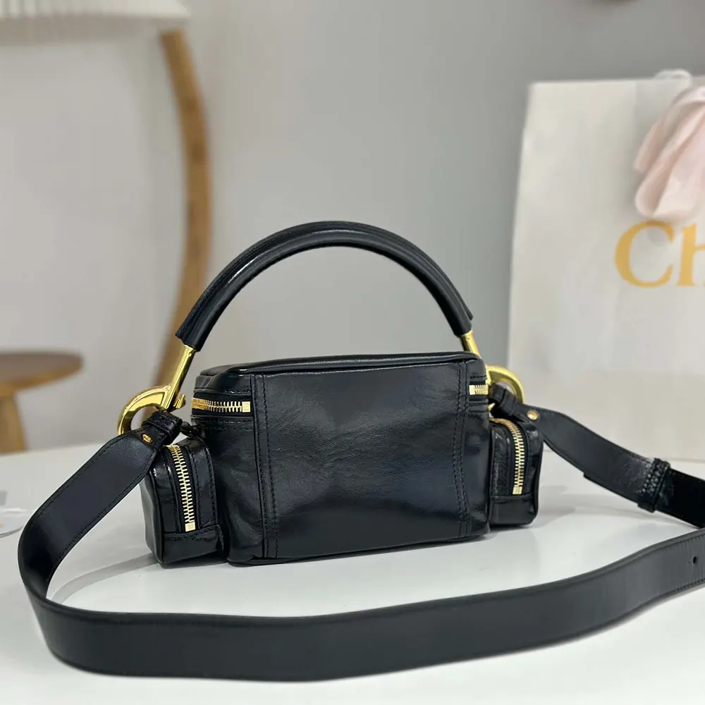 Side profile showing the adjustable shoulder strap on Chloe Women Small Camera Bag