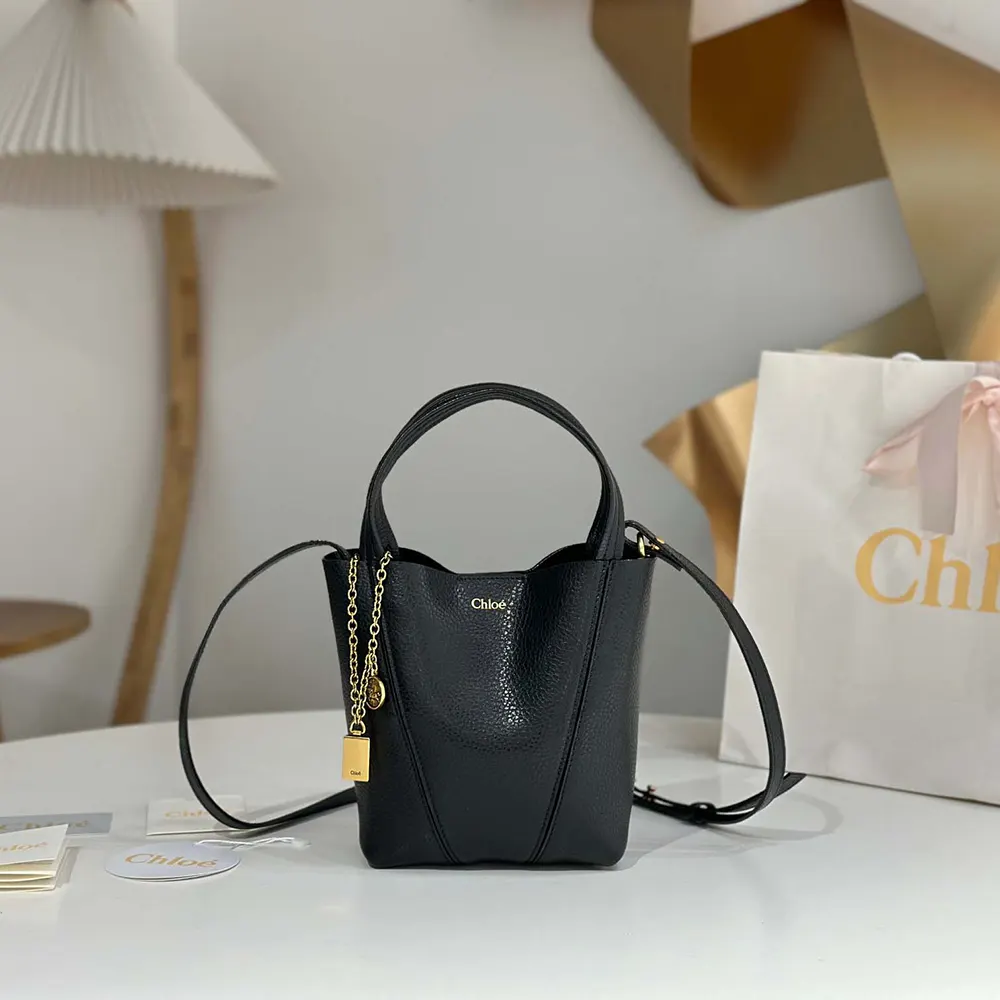 Close-up of gold-tone signature ring on Chloe Women Small Chloé Spin Tote Bag