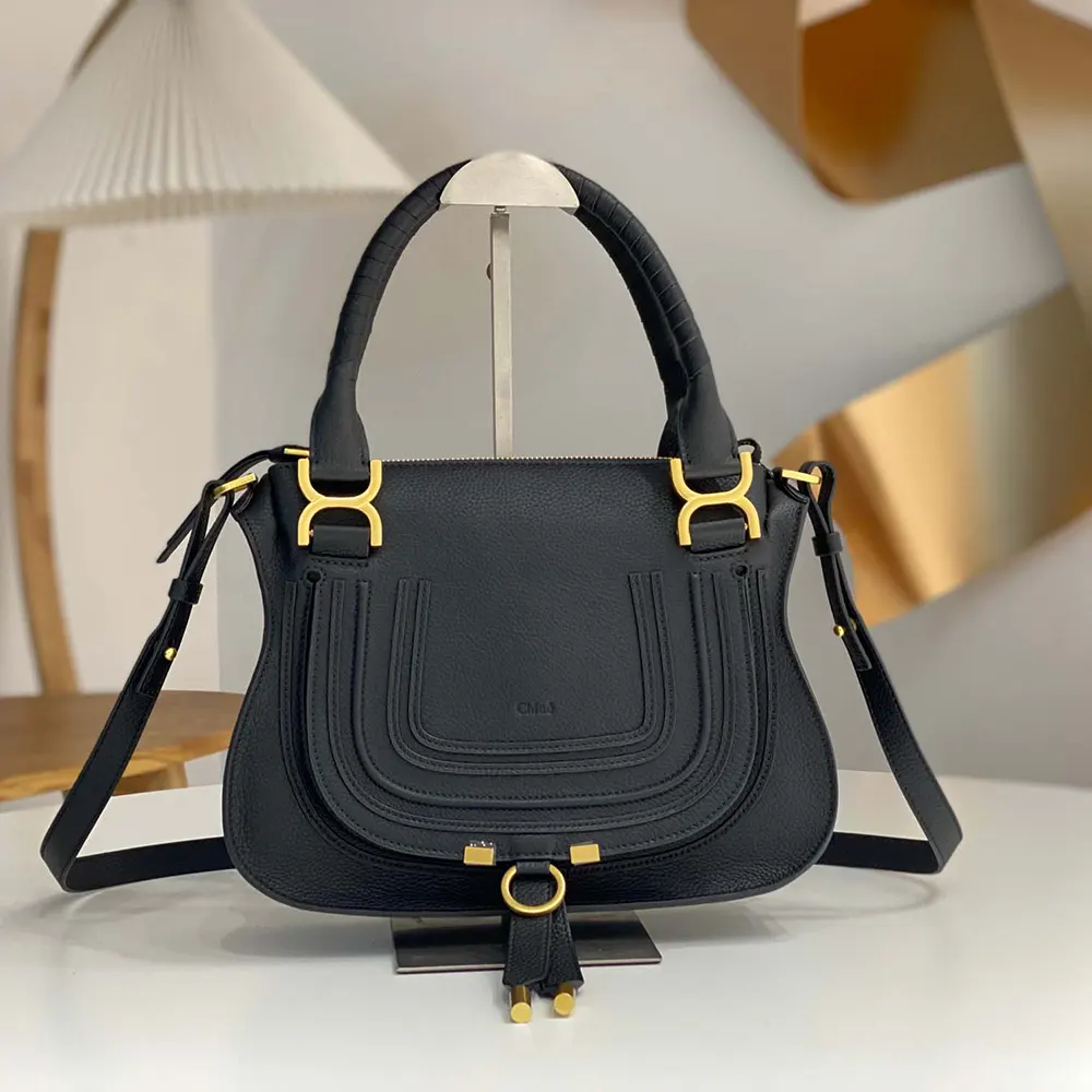 Close-up of gold-tone closure and brass hardware on Chloe Small Marcie Bag