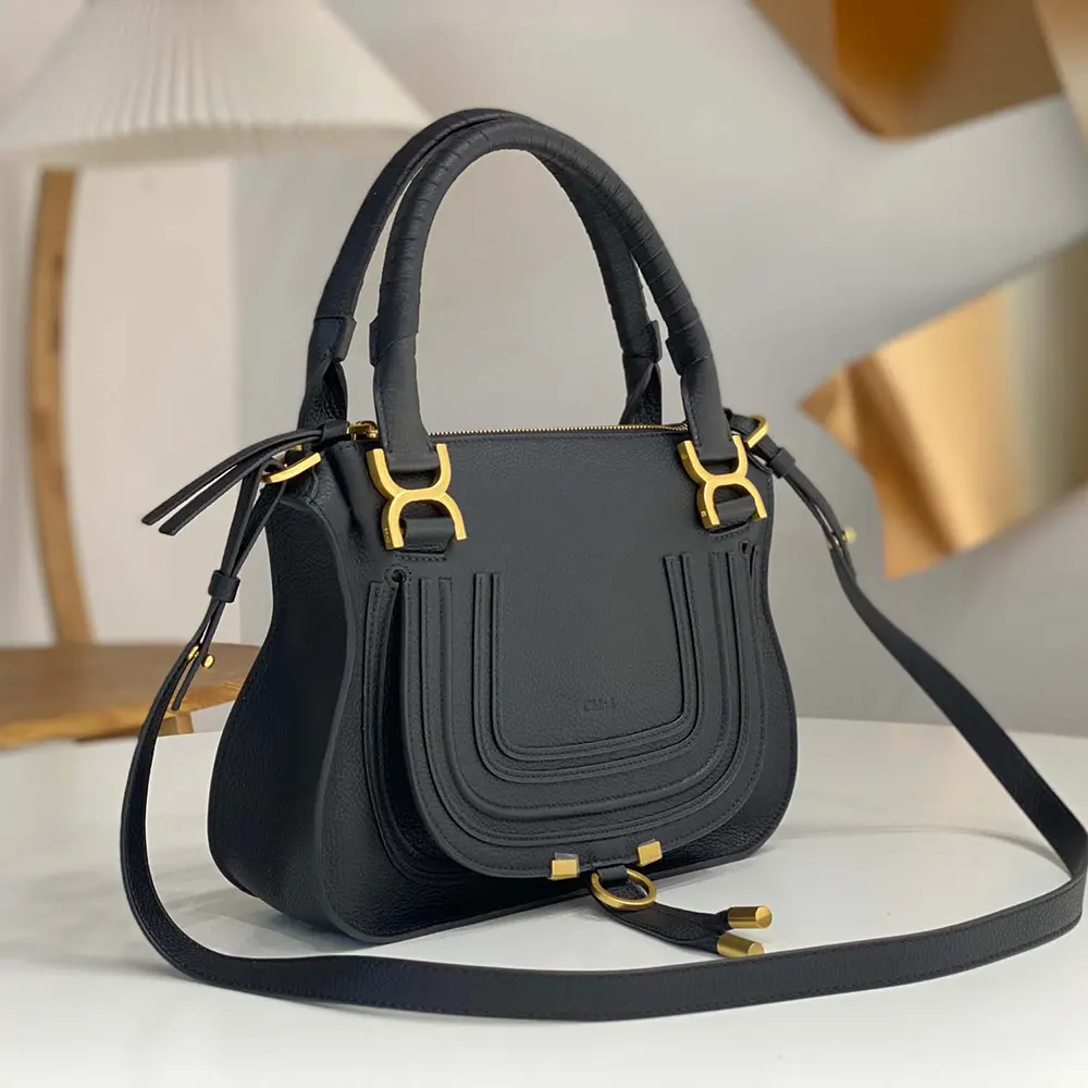 Side angle showing curved silhouette of Chloe Women Small Marcie Bag in Black