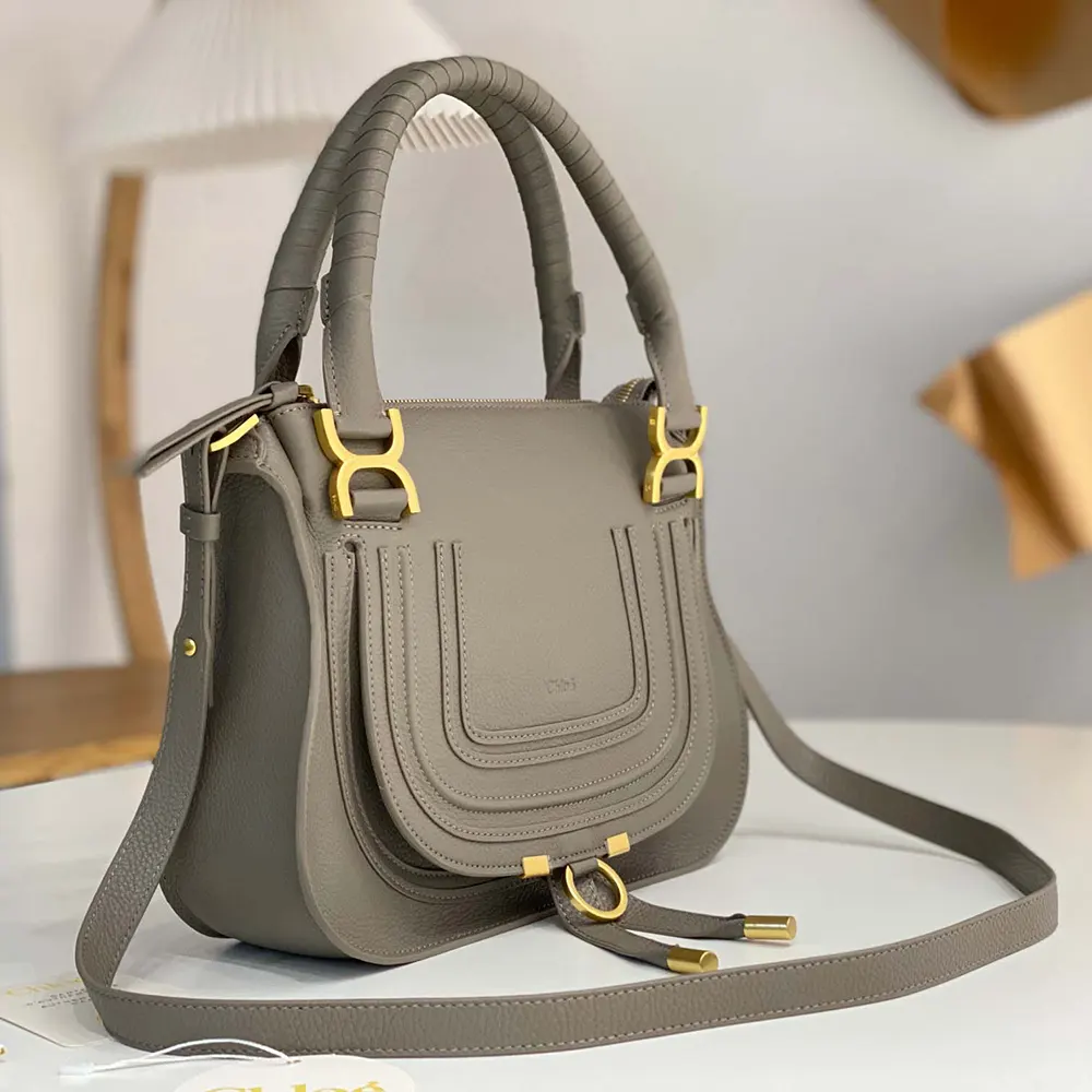 Side angle showing magnetic flap closure and strap on Chloe Small Marcie Bag