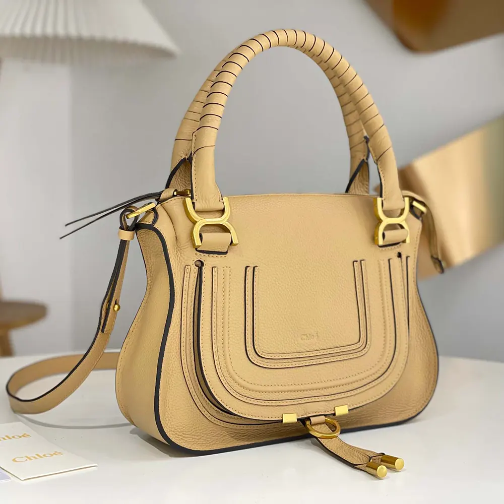 Side profile showing antique gold hardware on Chloe Women Small Marcie Bag