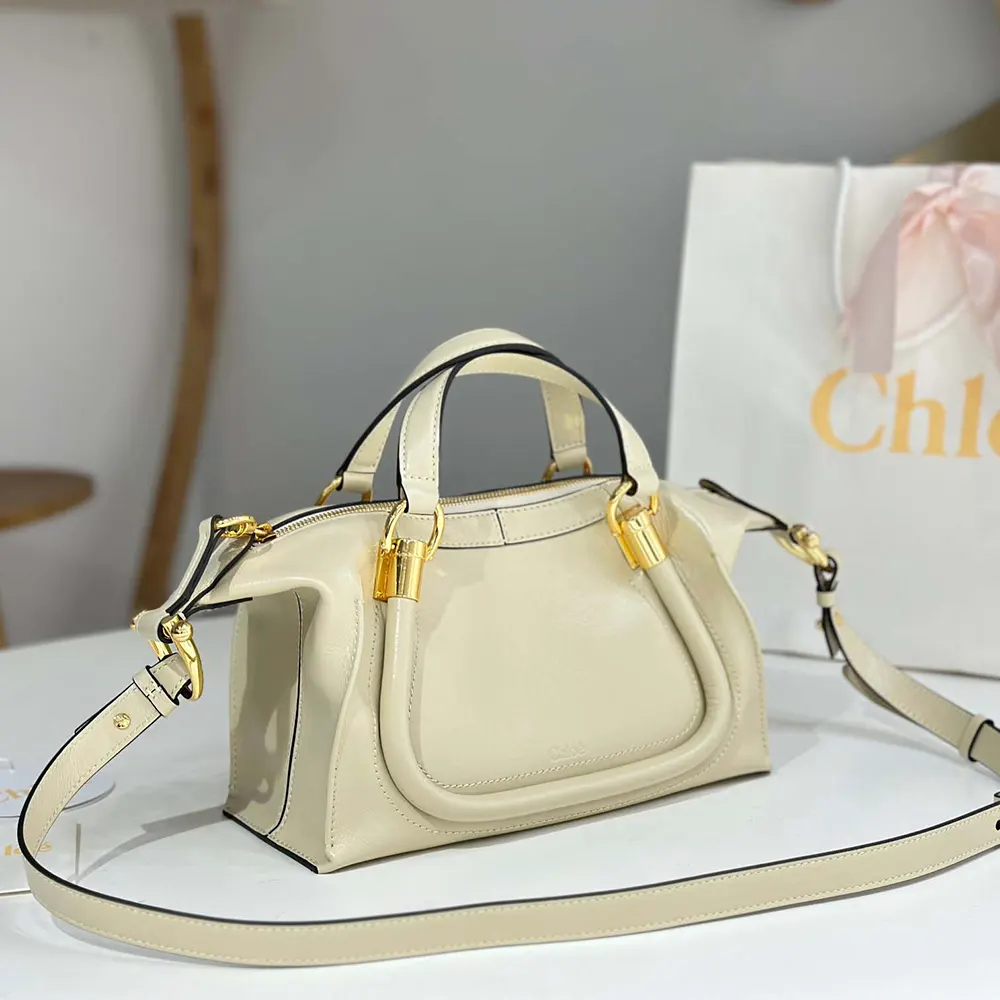 Side angle showing silhouette of Chloe Women Small Paraty 24 Bag beige leather