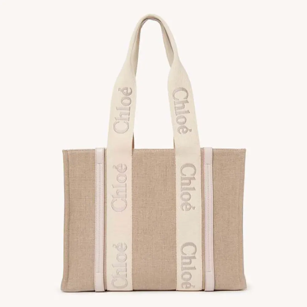 Front view of Chloe Women Woody Tote Bag in Linen-Pink with gold hardware