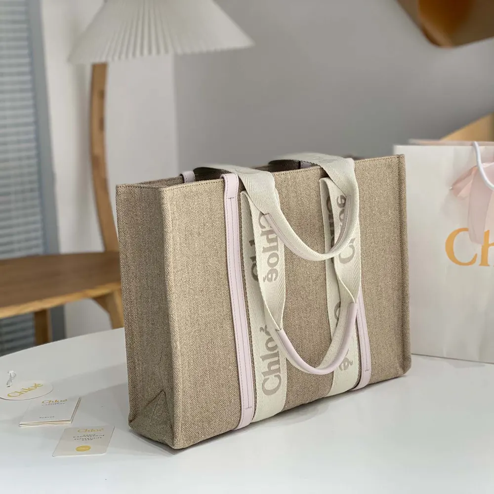 Side angle showing spacious interior of Chloe Women Woody Tote Bag in Linen-Pink
