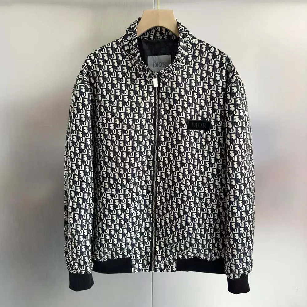 Close-up of signature Dior hardware on padded bomber jacket
