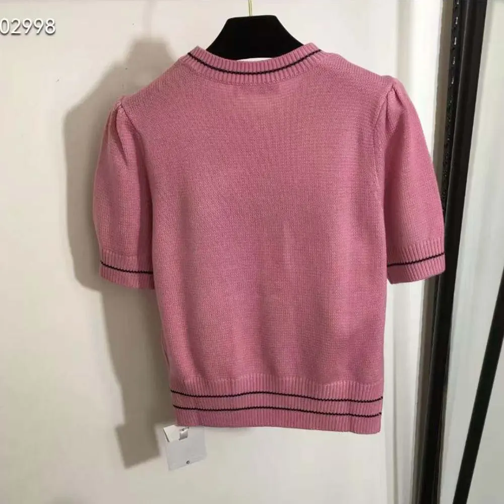 Side angle showing silhouette of Dior Women Christian Dior Short-Sleeved Sweater Pink Knit