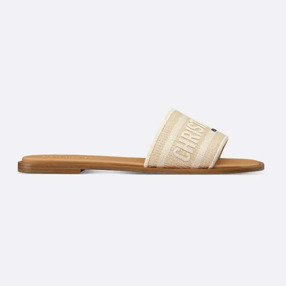 Side profile of Dior Women Dioriviera Dway Slide in natural raffia and white cotton