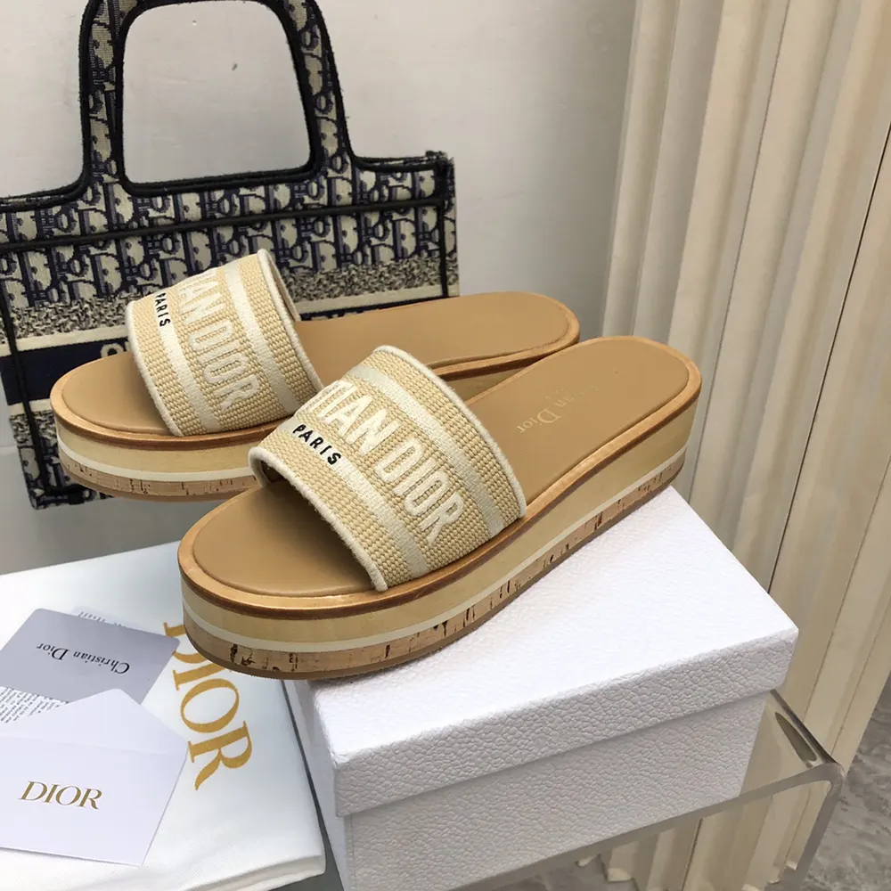 Close-up on white embroidered cotton and raffia texture of Dior Women Dway Platform Slide