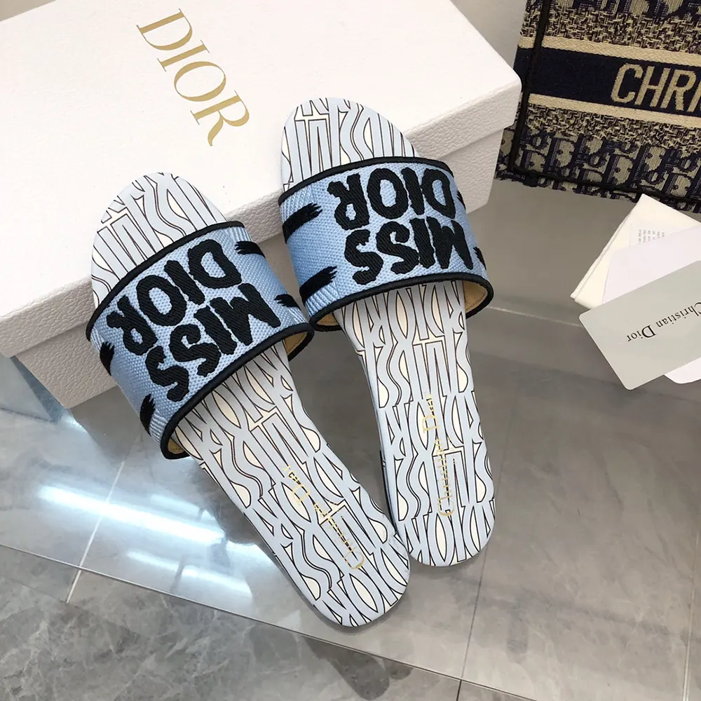 Side view showcasing gold-tone signature detail on Dior slide