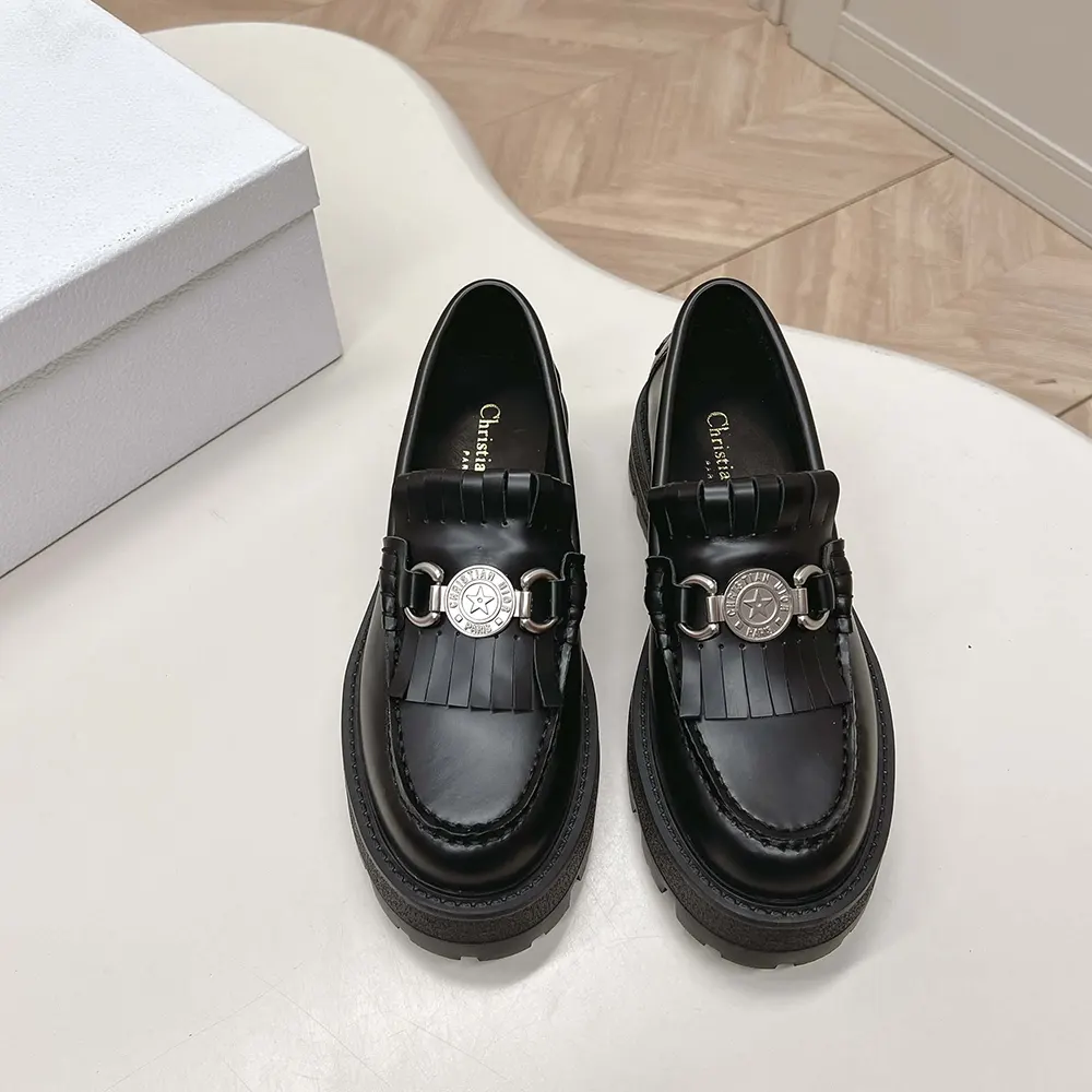 Close-up of polished emblem on Dior Women Emblem Loafer