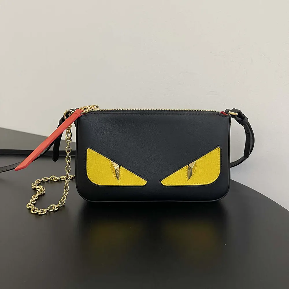 Close-up of gold-tone hardware on Fendi Women Baguette Pouch Lunar New Year