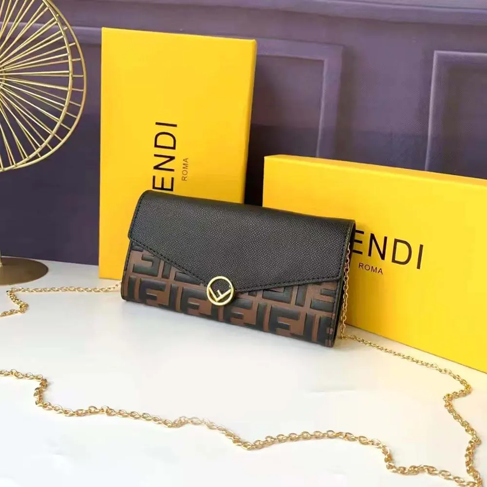 Close-up of brown leather texture and gold FF chain on wallet