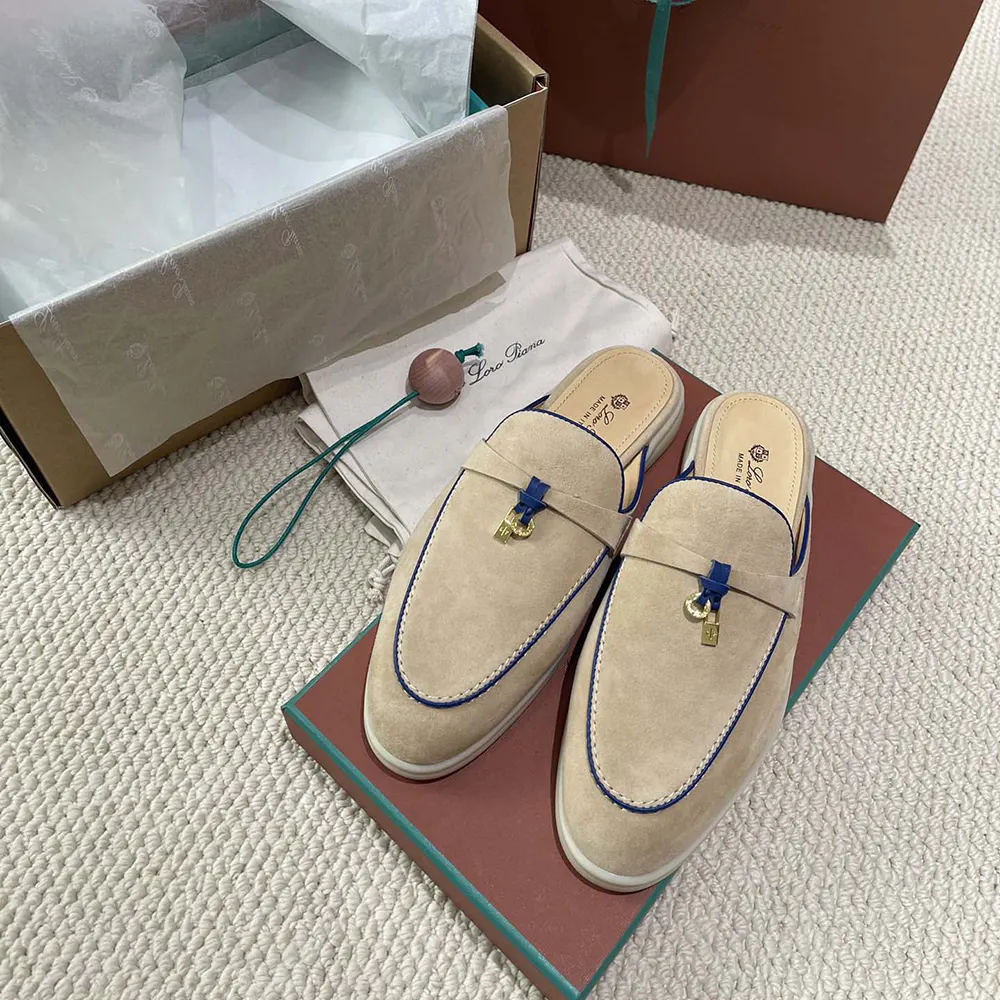 Close-up of gold-tone charms on Loro Piana Babouche Loafer-Beige