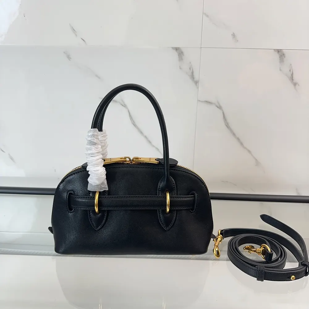 Side angle showing structured silhouette of Miu Miu Women Aventure Nappa Leather Top-handle Bag-Black
