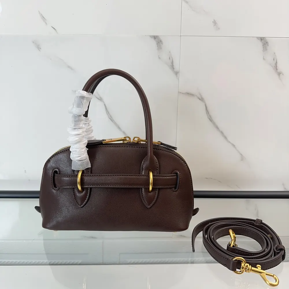 Side profile showing structure of Miu Miu Women Aventure Leather Bag Bordeaux