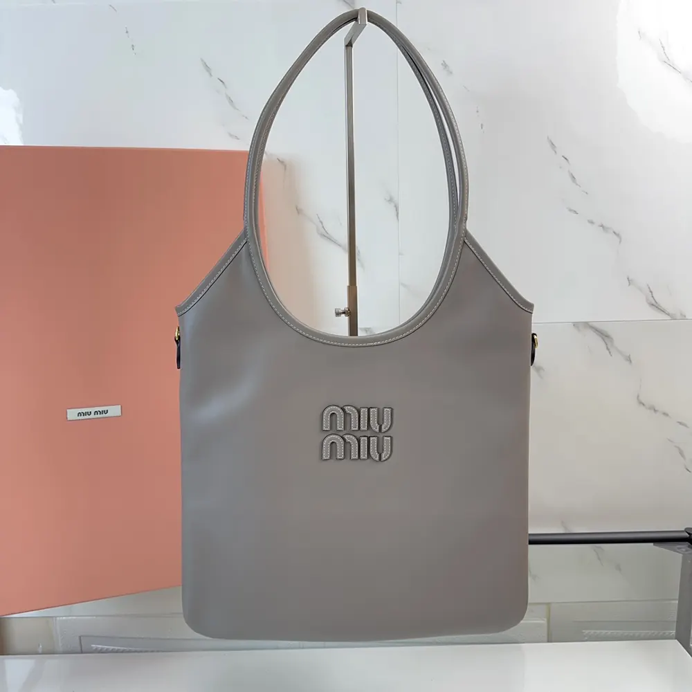 Close-up of smooth grey leather and signature clasp on Miu Miu Women IVY bag