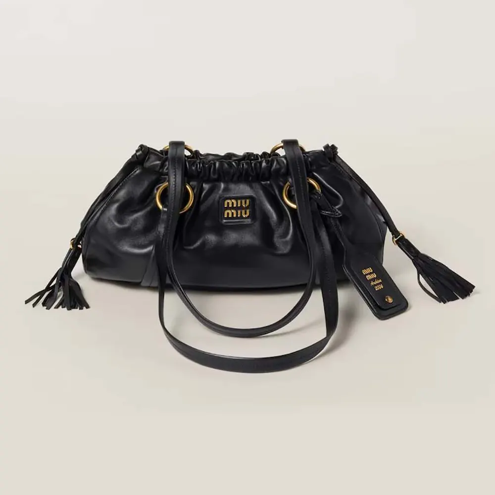 Front angle of Miu Miu Women Joie Nappa Leather Bag-Black showing sleek silhouette