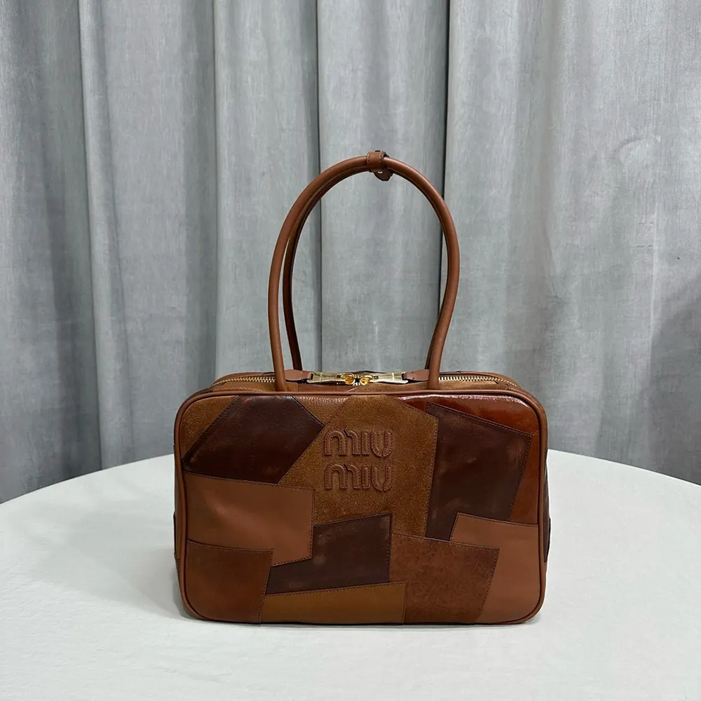 Close-up of gold hardware detail on Miu Miu Women Leather Patchwork Beau Bag-Brown