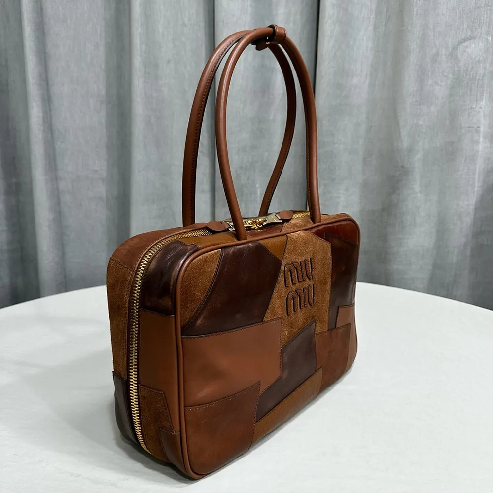Side profile showing patchwork texture on Miu Miu Women Leather Patchwork Beau Bag-Brown
