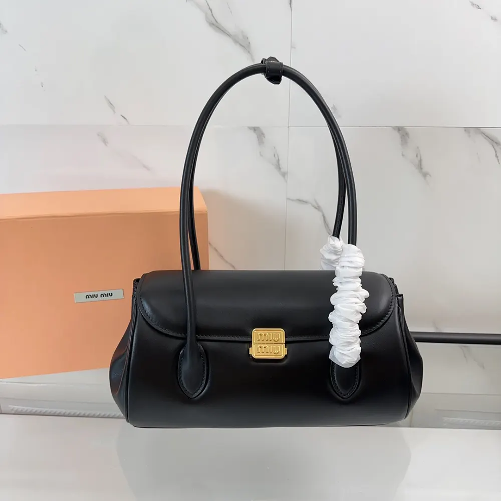 Close-up of gold-tone hardware on Miu Miu Women Leather Shoulder Bag-Black