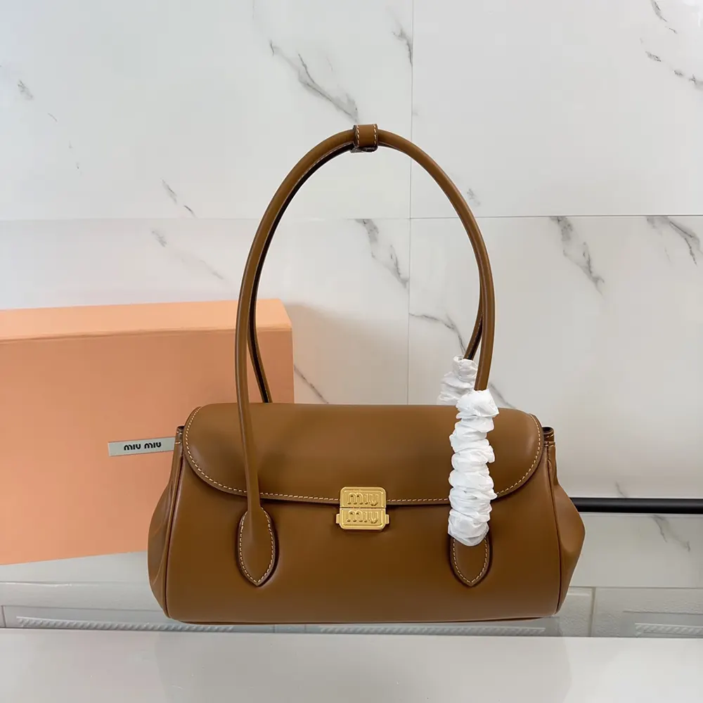 Close-up of gold-tone hardware on Miu Miu Women Leather Shoulder Bag-Brown