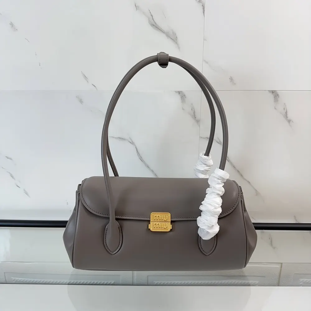Side profile highlighting adjustable strap on Miu Miu Women Leather Shoulder Bag-Grey