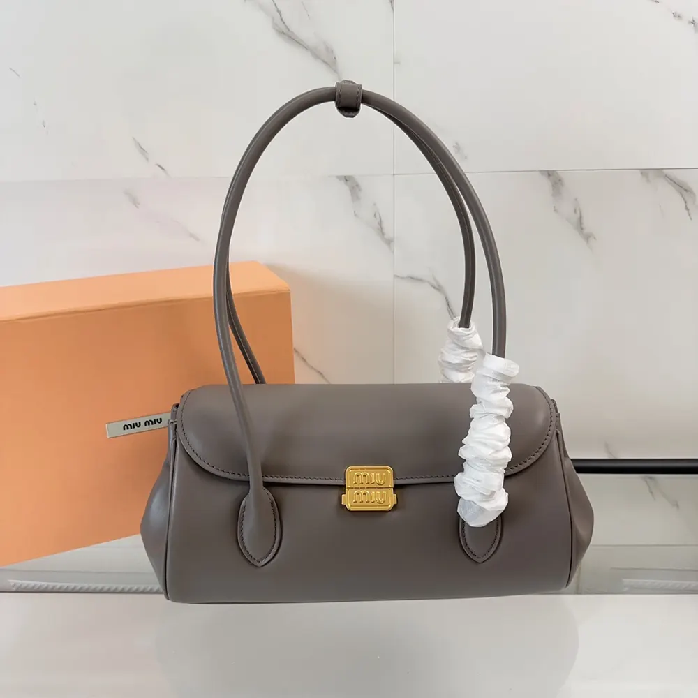 Close-up of silver-tone hardware on Miu Miu Women Leather Shoulder Bag-Grey