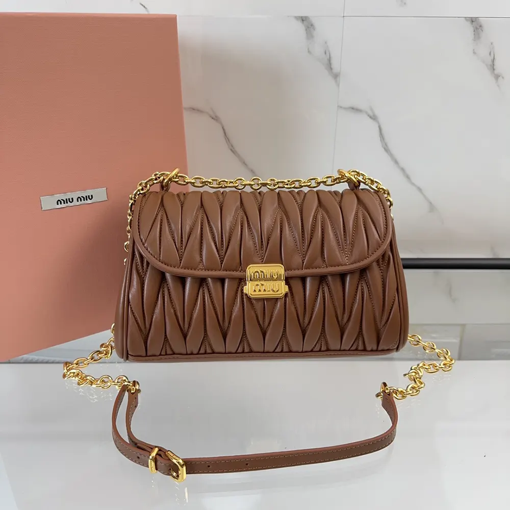 Close-up of polished gold-tone hardware on Miu Miu Women Matelassé Nappa Leather Shoulder Bag-Brown