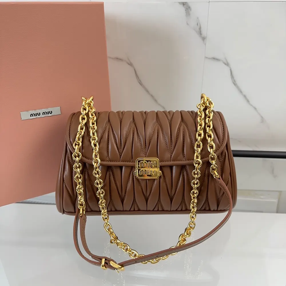 Side angle highlighting compact shape of Miu Miu Women Matelassé Nappa Leather Shoulder Bag-Brown