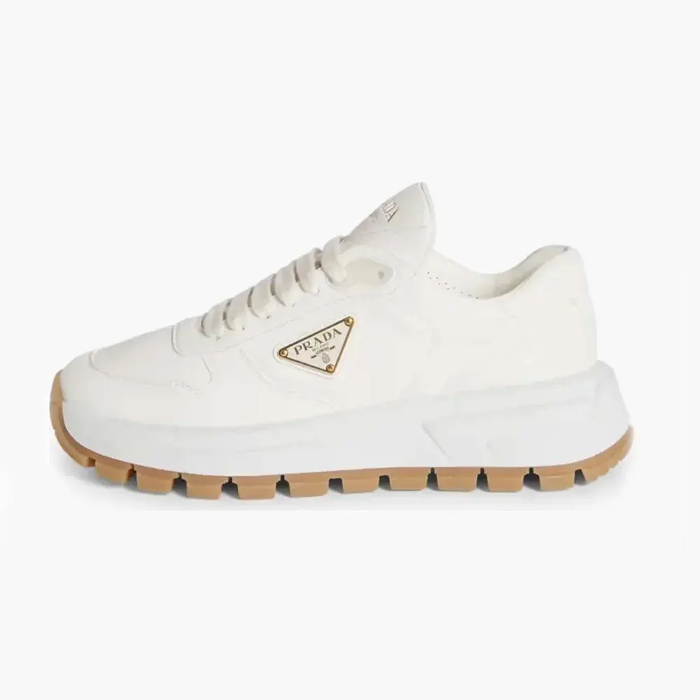 Side profile of Prada Unisex Triangle Logo Leather Sneakers-White in full view