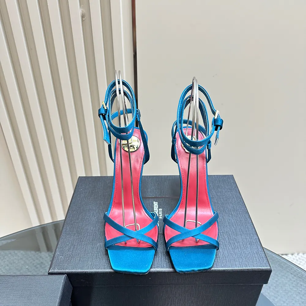 Close-up of gold YSL logo on Saint Laurent YSL Women Opyum Sandals