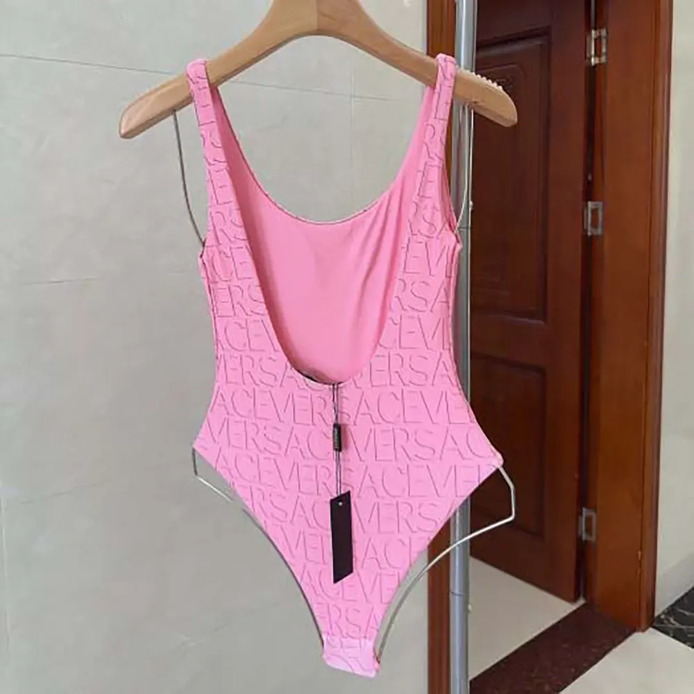 Side profile of Versace Women Allover One-piece Swimsuit-Pink highlighting silhouette