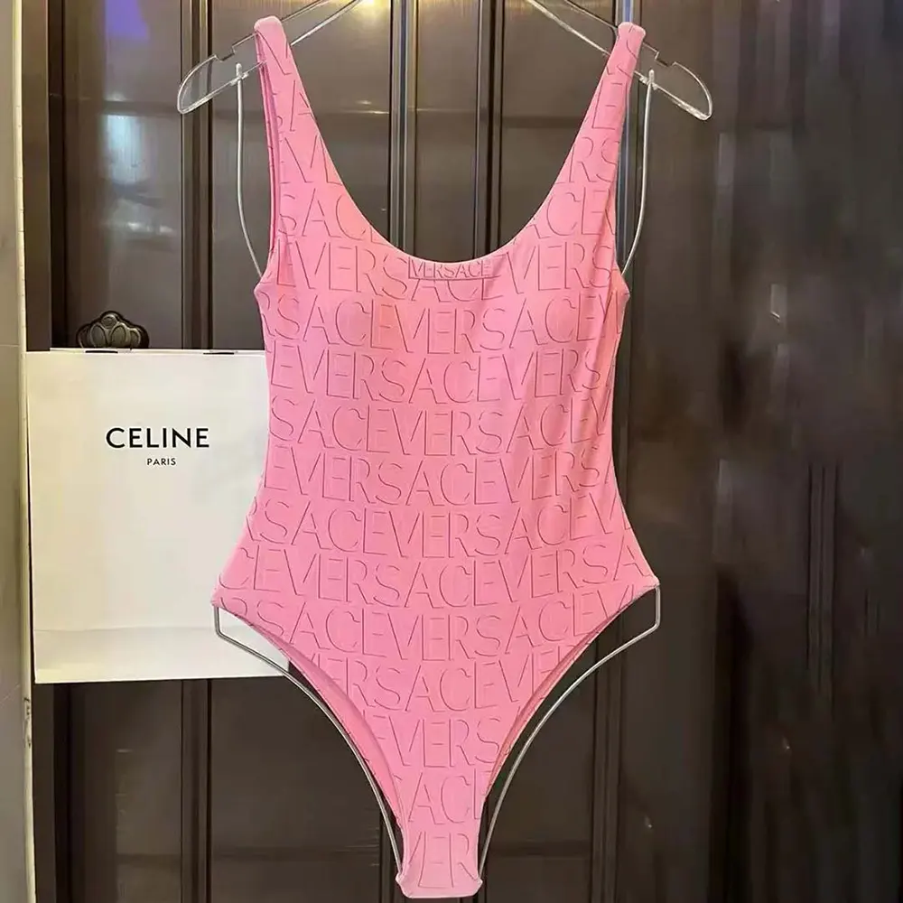 Front view of Versace Women Allover One-piece Swimsuit-Pink showing signature print