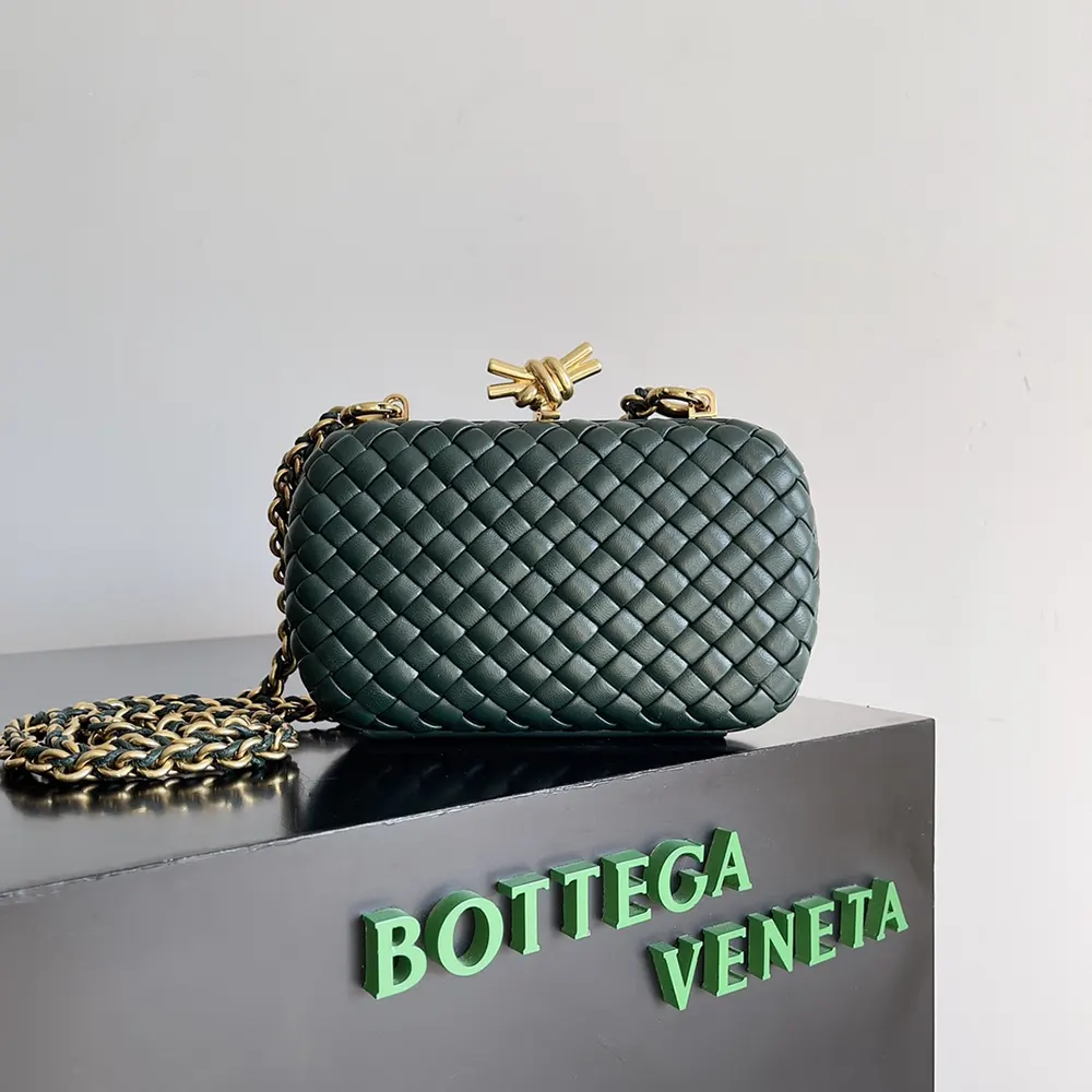 Close-up of gold-tone knot clasp on Bottega Veneta Women Knot Minaudière Clutch