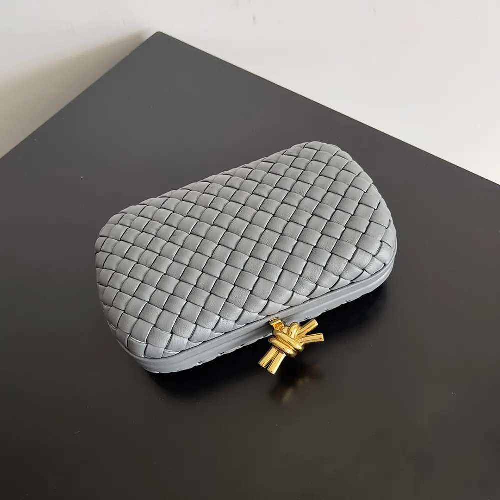 Side view showing sleek silhouette of Bottega Veneta Knot Minaudière clutch