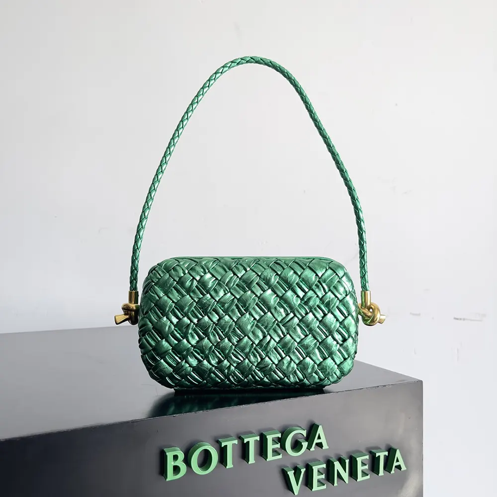 Close-up detail of intrecciato leather weave on Bottega Veneta Women Knot Minaudiere On Strap-Green