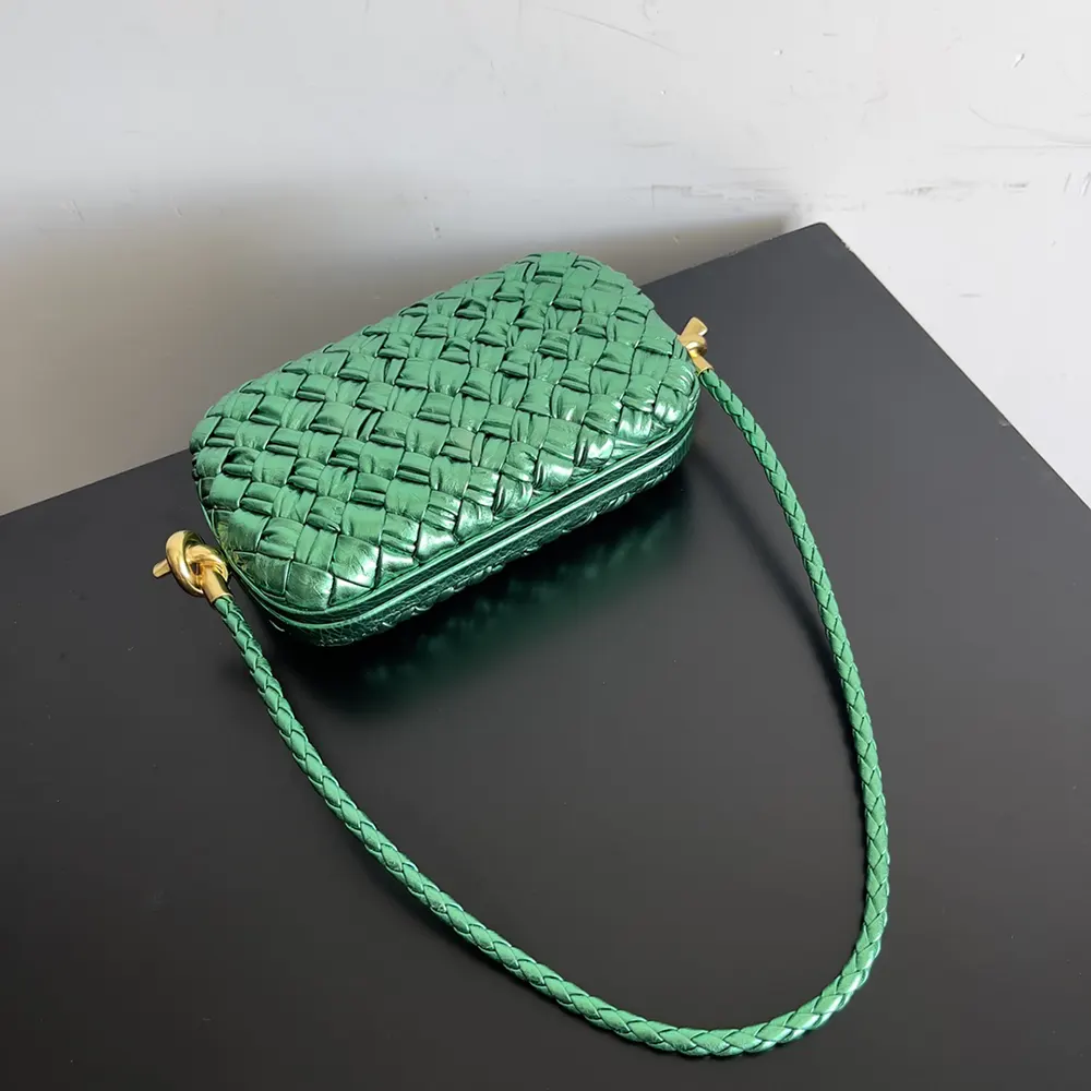 Side angle highlighting adjustable strap and gold hardware of Bottega Veneta Women Knot Minaudiere On Strap-Green