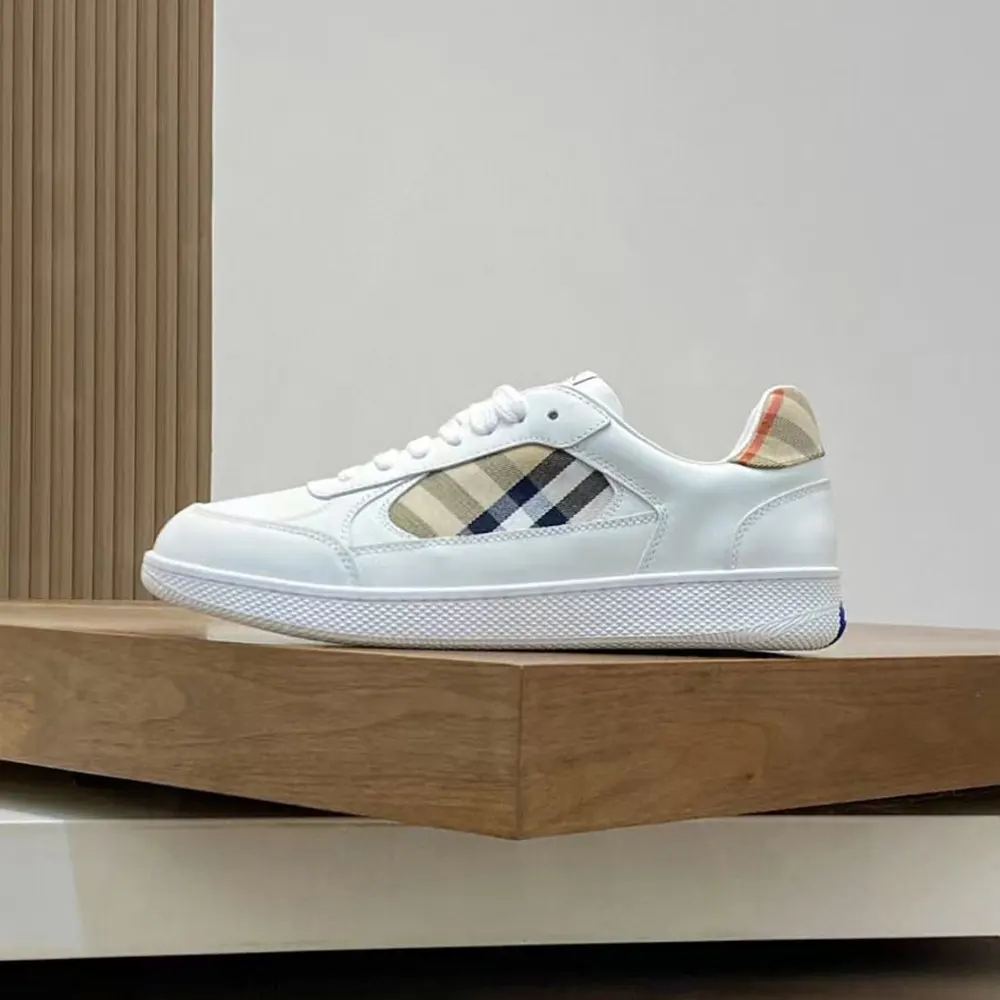 Close-up on Burberry check detail and leather texture of sneakers