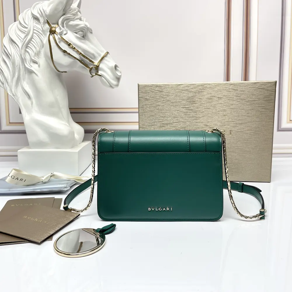 Side angle showing gold-tone hardware on Bvlgari green shoulder bag