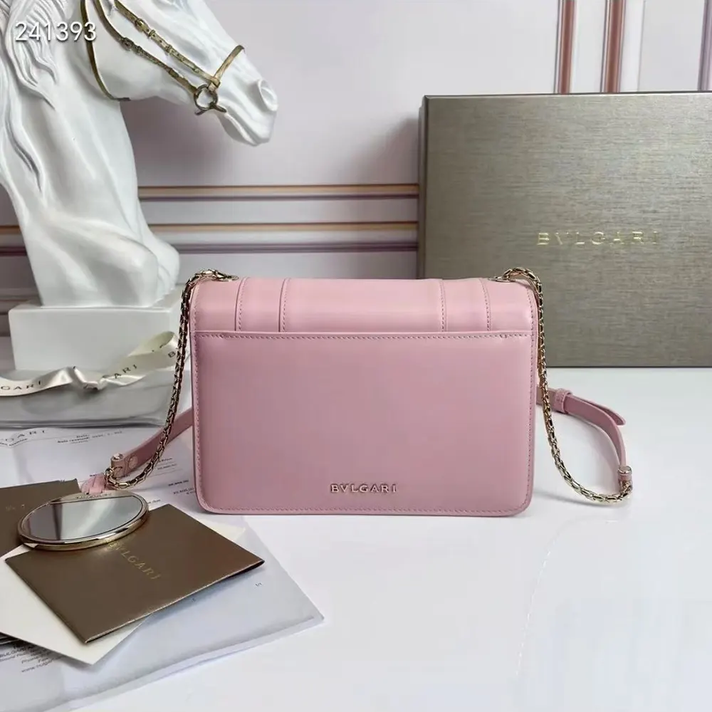 Side angle showcasing pink leather and strap of Bvlgari Mini Serpenti Forever Shoulder Bag