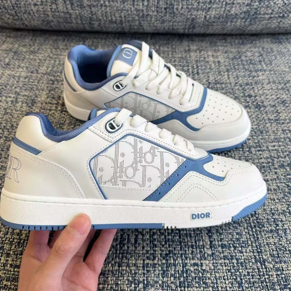 Side profile showing sleek silhouette and lace-up closure of Dior Uptown sneaker