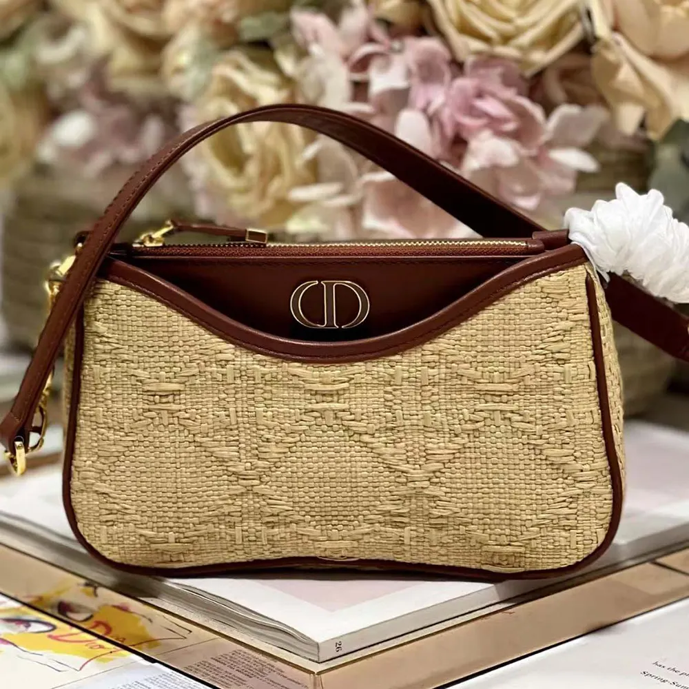 Close-up of cannage raffia pattern and silver CD hardware on Dior mini bag