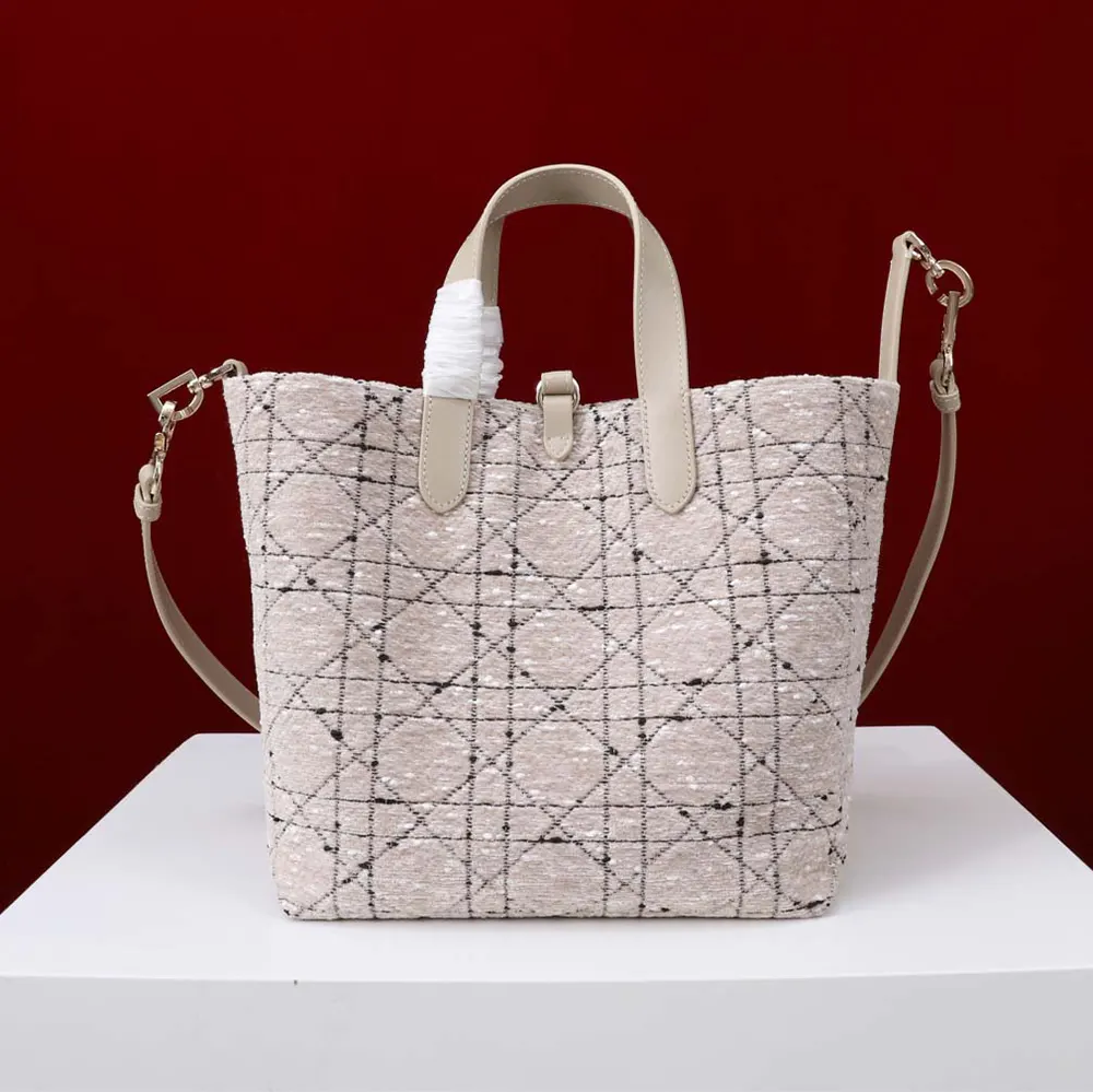 Side angle showing silver-tone hardware on Dior Women Medium Dior Toujours Tote Bag
