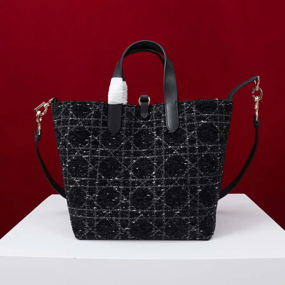 Side angle showing silver-tone hardware on Dior Women Medium Dior Toujours Vertical Tote Bag