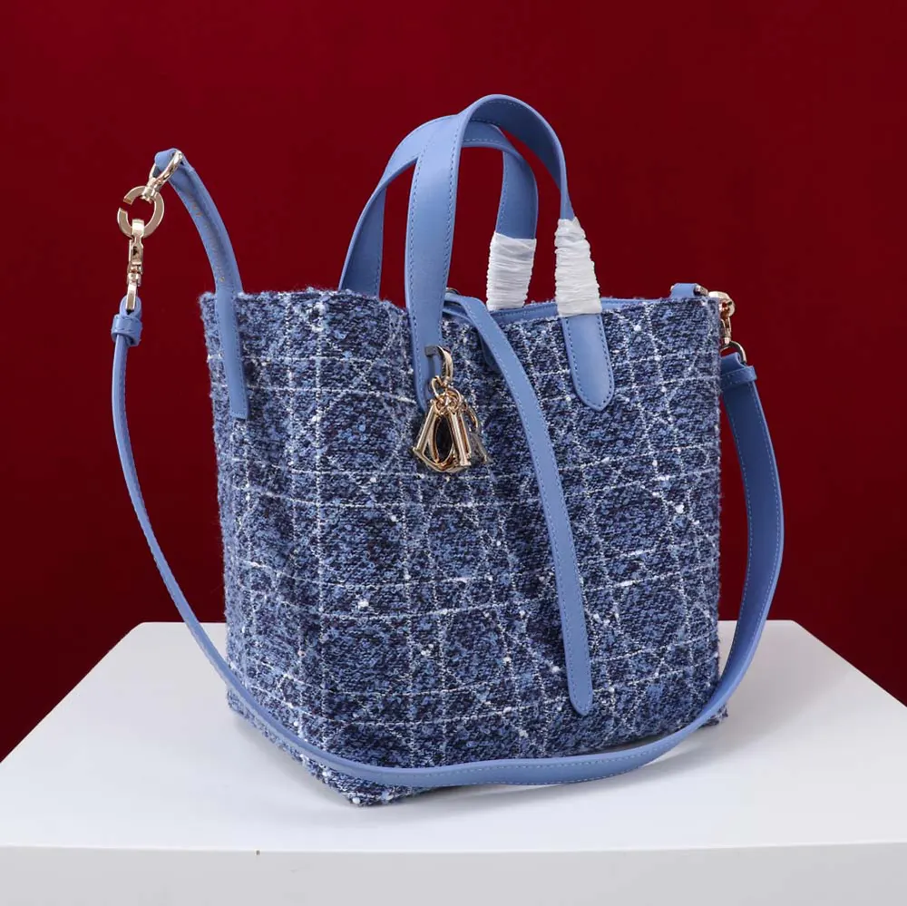 Side angle showing silver hardware on Dior Women Medium Dior Toujours Vertical Tote Bag
