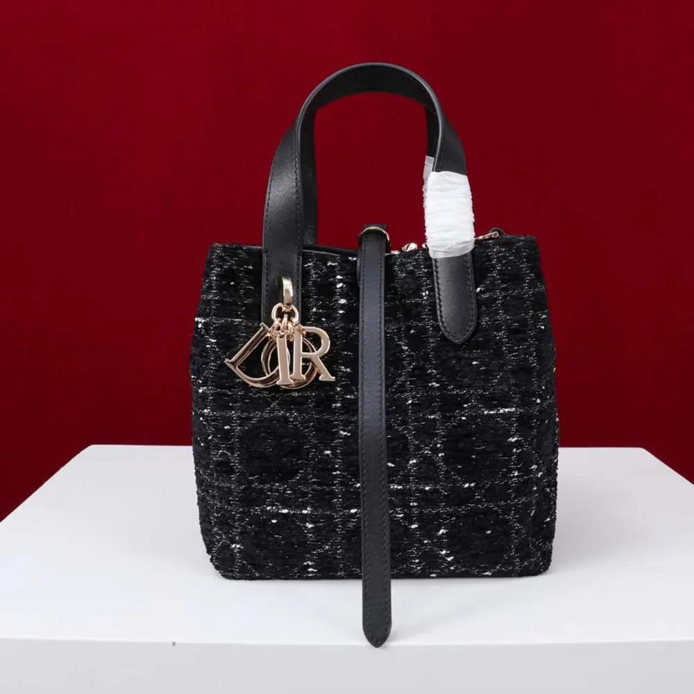 Side angle showing silver hardware on Dior Women Small Dior Toujours Vertical Tote Bag